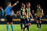 Wout Brama (R) of the Mariners is sent off against the Wanderers in Gosford.