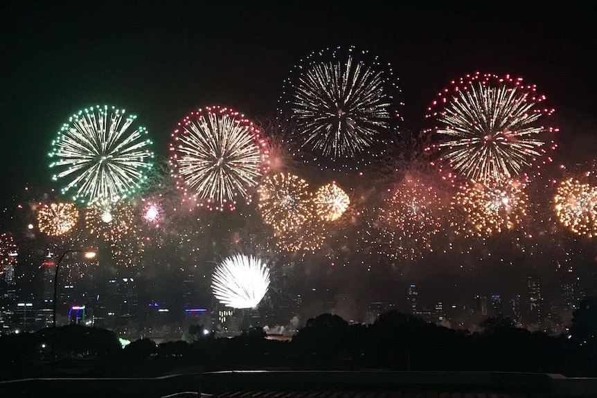 Colourful fireworks light up the Perth skyline view from South Perth Australia Day celebration.