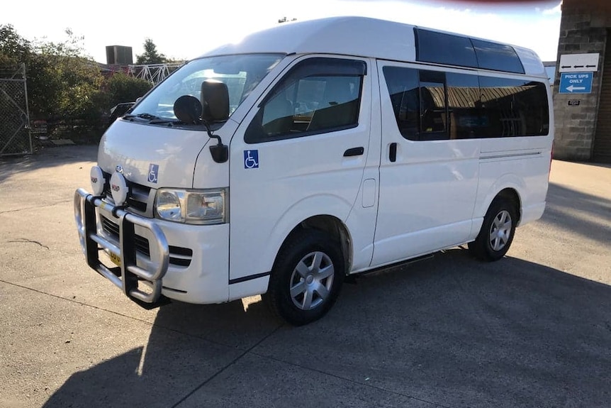 Image of white mini bus