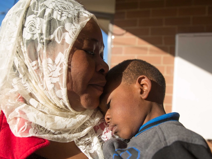 Mortada nestles into his mum's chest.