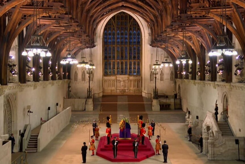 The grand Westminster Hall empty except for guards and the coffin