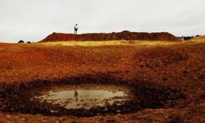 A dry dam on a drought affected farm property