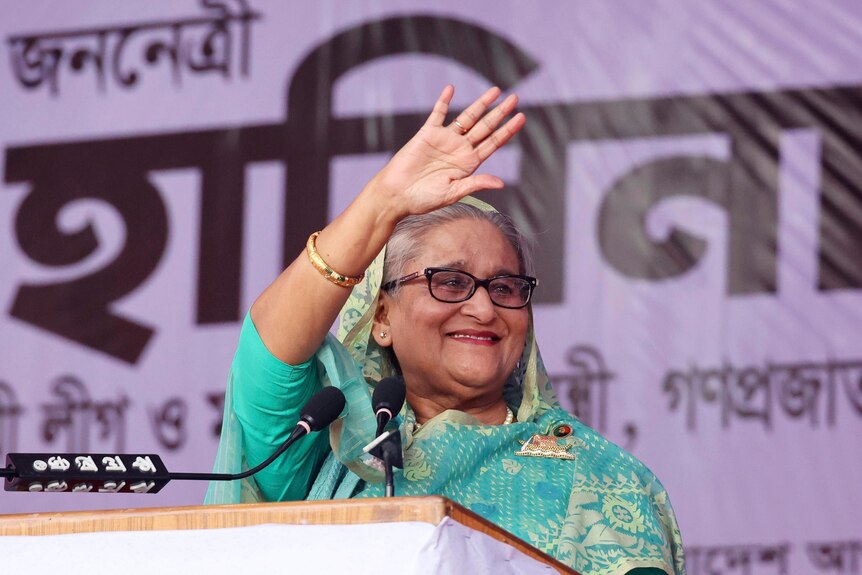 Bangladesh's Prime Minister Sheikh Hasina waves to a gathering.