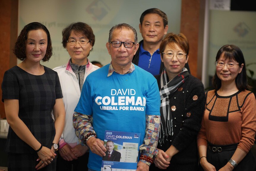 Several volunteers campaigning for the Liberal Party's candidate for the seat of Banks, David Coleman, pose for a photo.