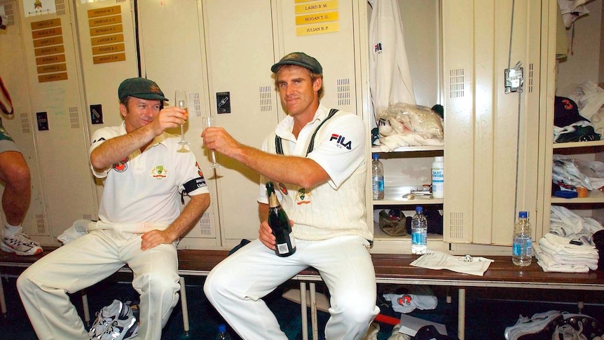 Matthew Hayden and Steve Waugh sit in the changerooms at the WACA Ground in their Test cricket whites drinking champagne.