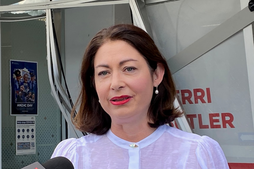 MP Terri Butler speaking to reporters outside her damaged office