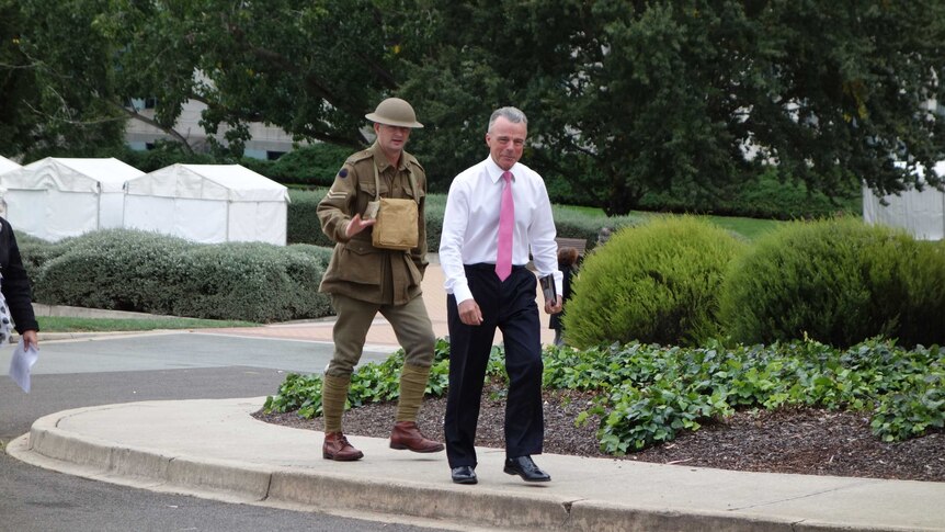 Memorial director Dr Brendan Nelson and a man dressed as a soldier from the Western Front.