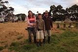 Carmen Holloway and James Hill, with their son Evan, on their new farm on King Island which is being opened to tourists