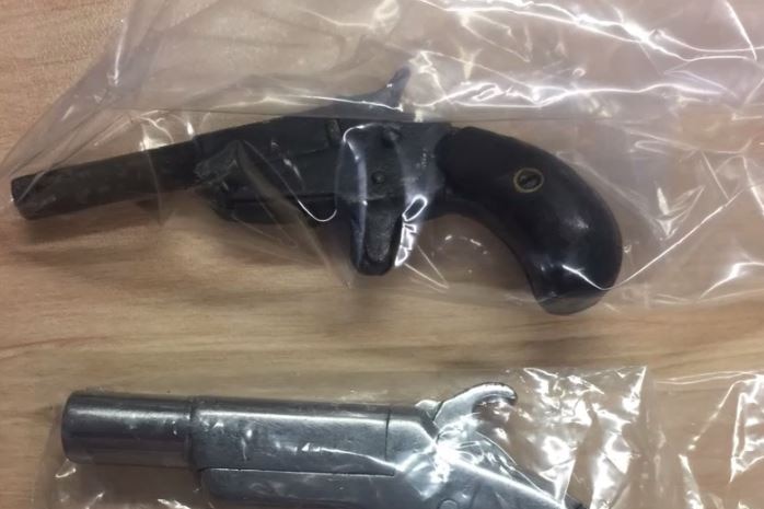 A loaded handgun (top) found between the buttocks of a man
