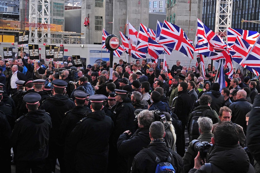 Protesters demonstrate outside the Old Bailey court in London.