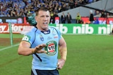 Paul Gallen clutches his side during State of Origin II