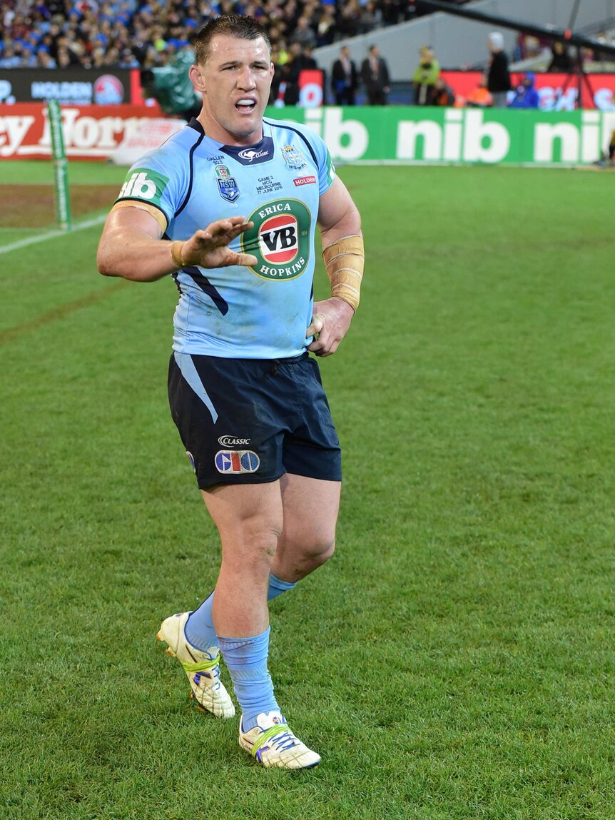 Paul Gallen clutches his side during State of Origin II