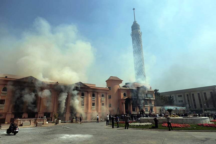 Smoke rises from the police officers' club in Cairo