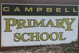 A concrete sign that reads "Campbell Primary School.