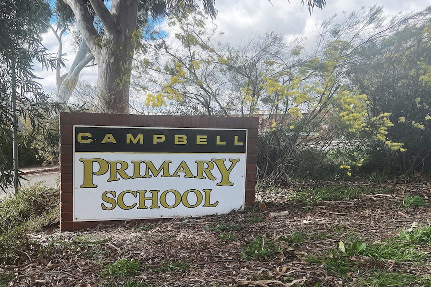 A concrete sign that reads "Campbell Primary School.