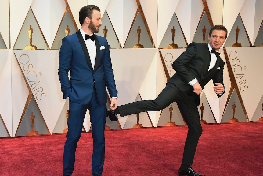 Chris Evans and Jeremy Renner arrive at the Oscars