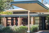 The entrance to the Villa Maria aged care home building, with lavender plants in the garden.