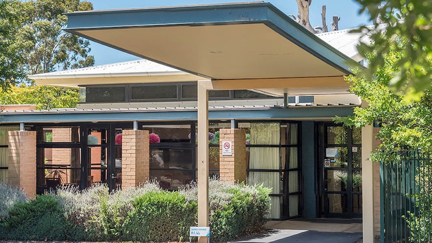 The entrance to the Villa Maria aged care home building, with lavender plants in the garden.