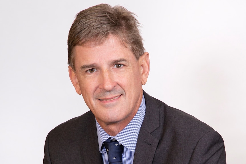 A profile shot of a middle-aged man with brown hair