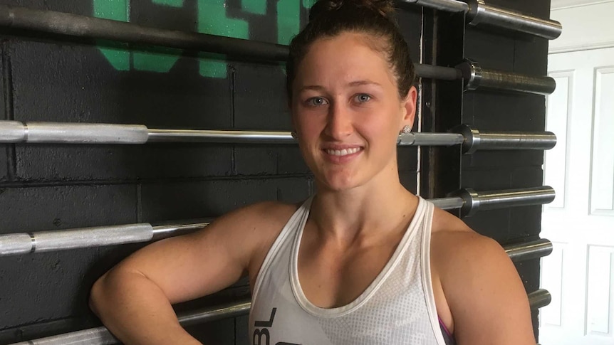 Tia-Clair Toomey relaxes after a weightlifting training session.