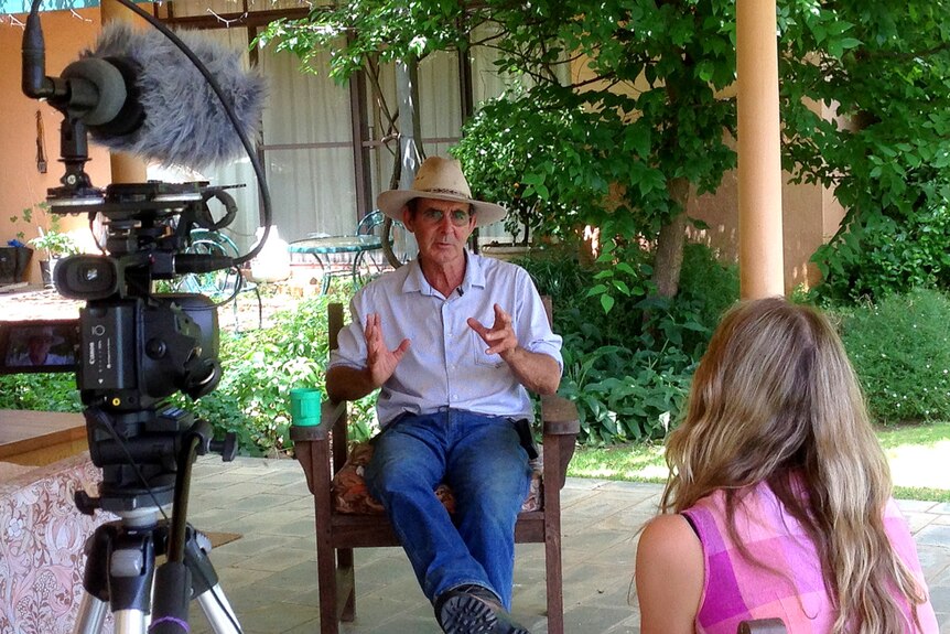 David Marsh sits on his verandah, doing a piece to camera for a Follow the Farmer promotion.