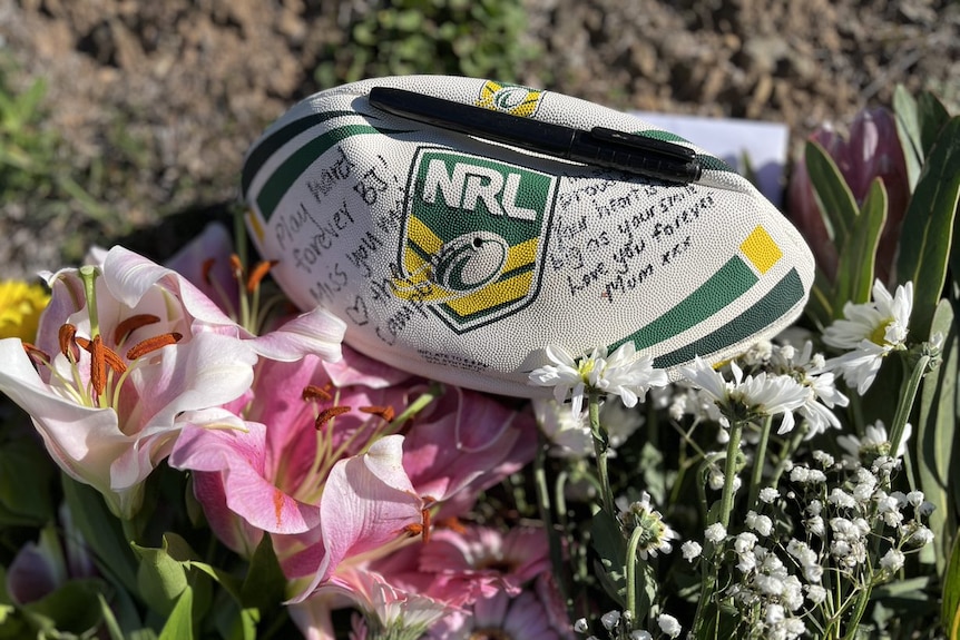 A football sits on flowers