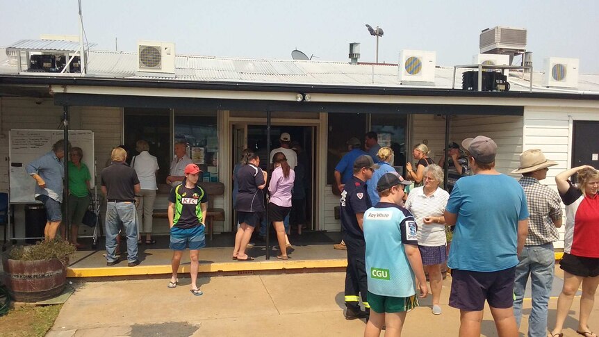 Coolah residents pack a sports club for a bushfire update.