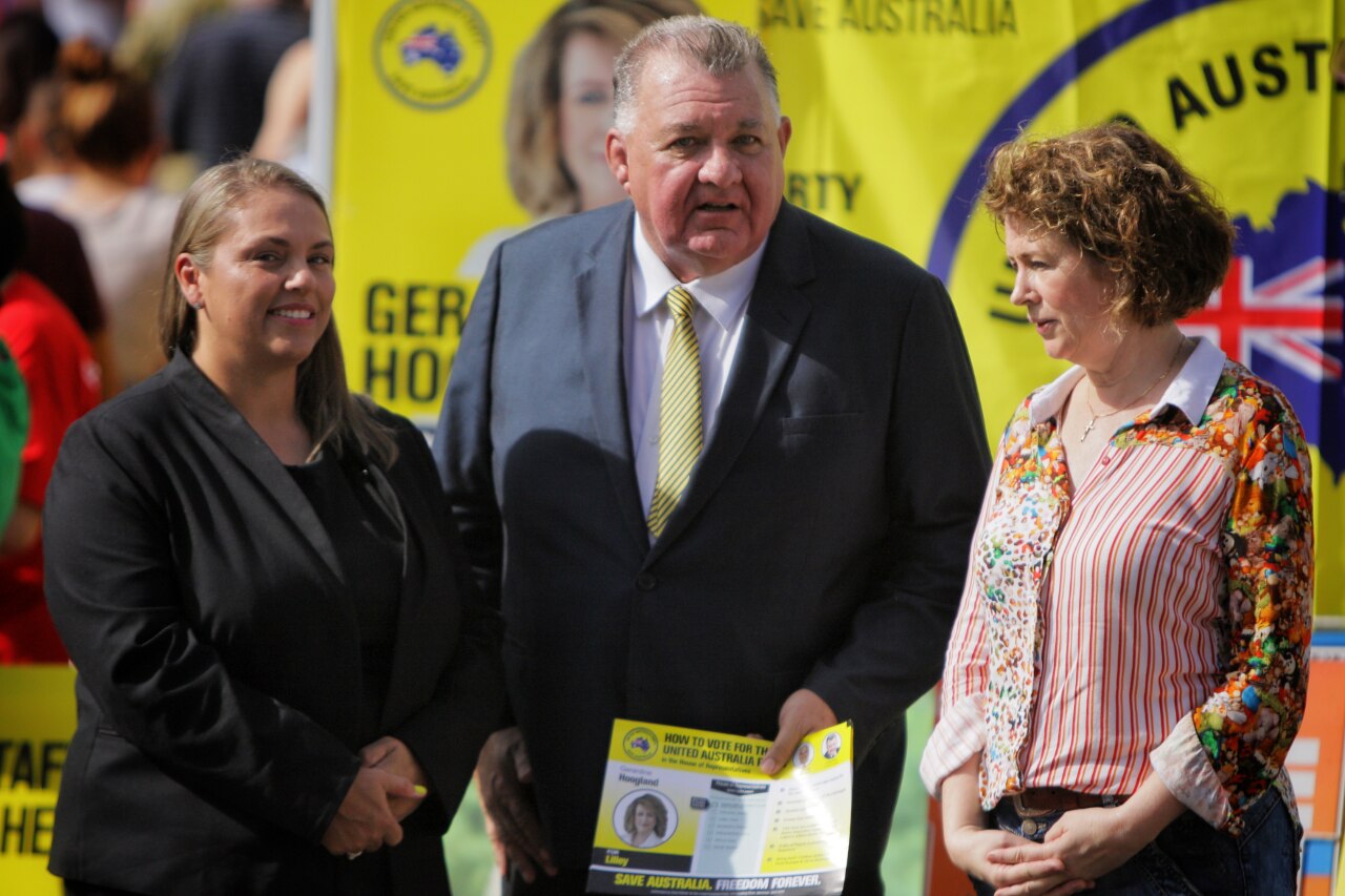 Craig Kelly talks to colleagues.