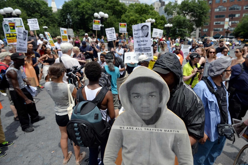 Cardboard cutout of Trayvon Martin at demonstration after George Zimmerman was found not guilty.