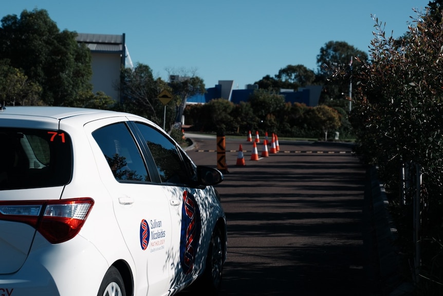 A Sullivan Nicolaides car at the entrance to a clinic.