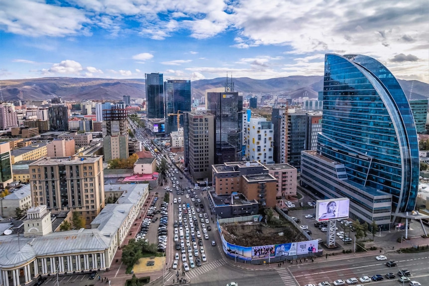 A wide landscape shot of the Mongolian capital city of Ulaanbaatar