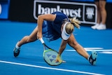 Daria Gavrilova struggles to reach a return at the baseline at the Hopman Cup in Perth.
