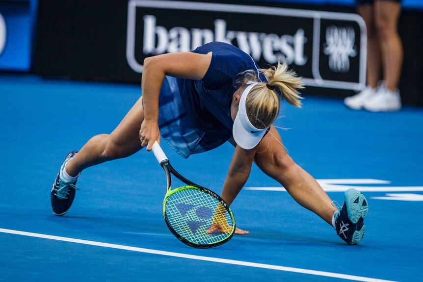 Daria Gavrilova struggles to reach a return at the baseline at the Hopman Cup in Perth.