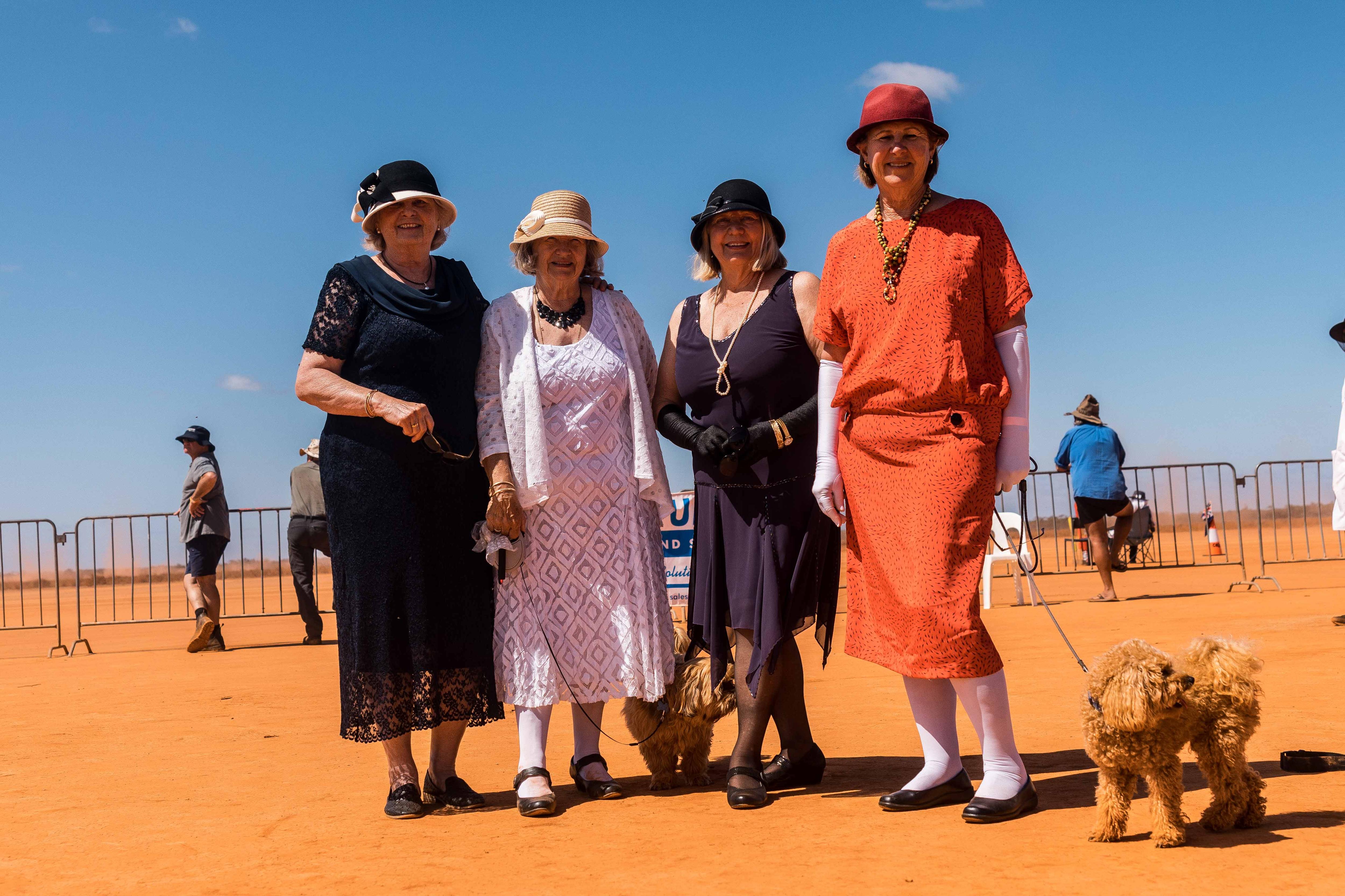 A group of four women dressed in 1920s fashion.  