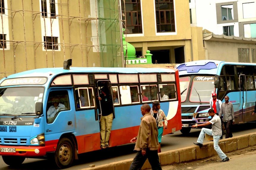 A line of buses wait in traffic in Kenya