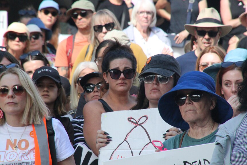 people gathered at rally calling for end to violence against women
