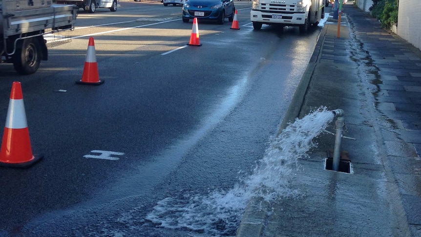 Pipe gushes water from burst main