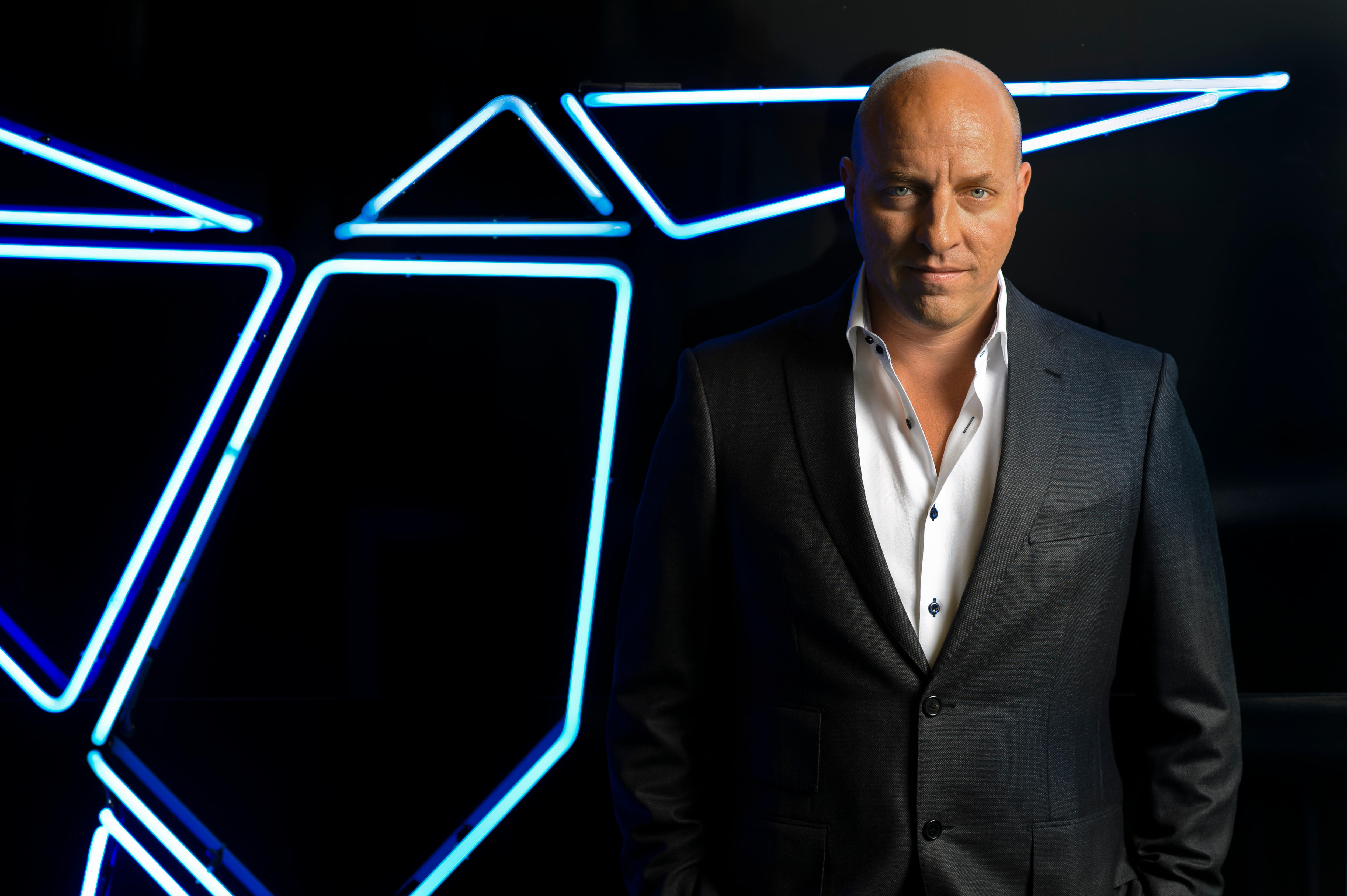 Man in suit looks at camera 