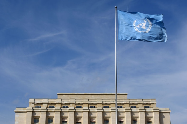 United Nations flag flying outside Geneva UN headquarters (Reuters: Denis Balibouse)