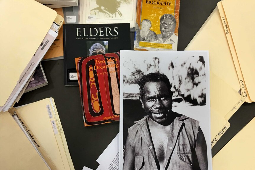 Research materials including a picture of land rights activist, Dexter Daniels.