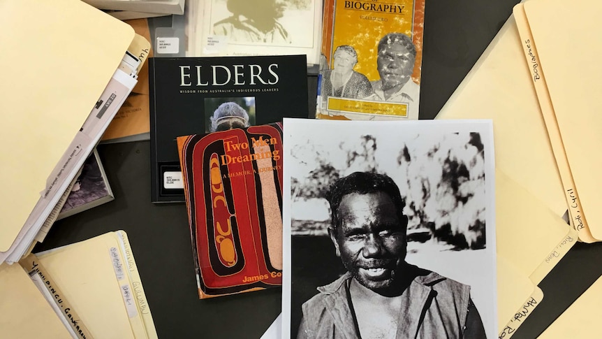 Research materials including a picture of land rights activist, Dexter Daniels.
