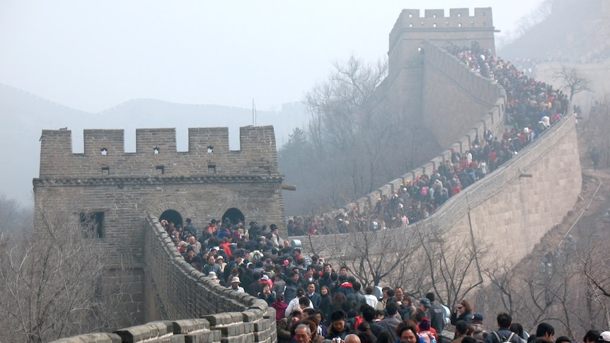 A large crowd covers the main walkways in this image of the Great Wall of China, taken in 2011.
