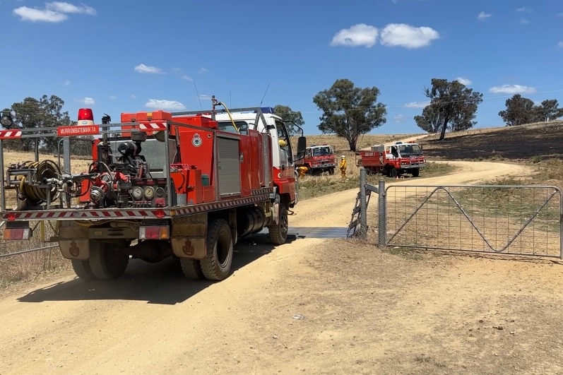 Rural fire truck driving through a farm gate. 