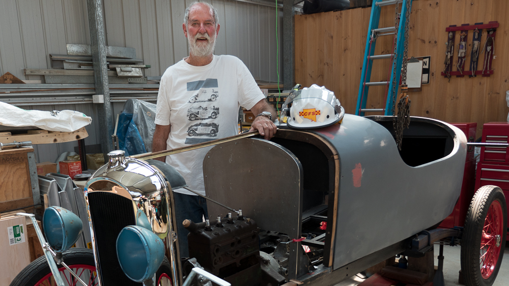 73-year-old CFS volunteer Professor Garth Morgan with his vintage car rebuild project.
