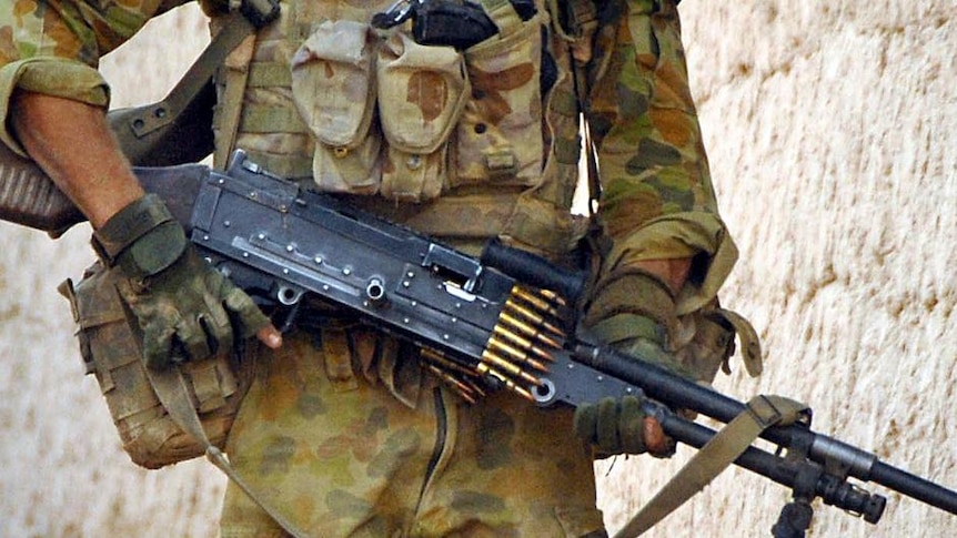 An Australian soldier patrols