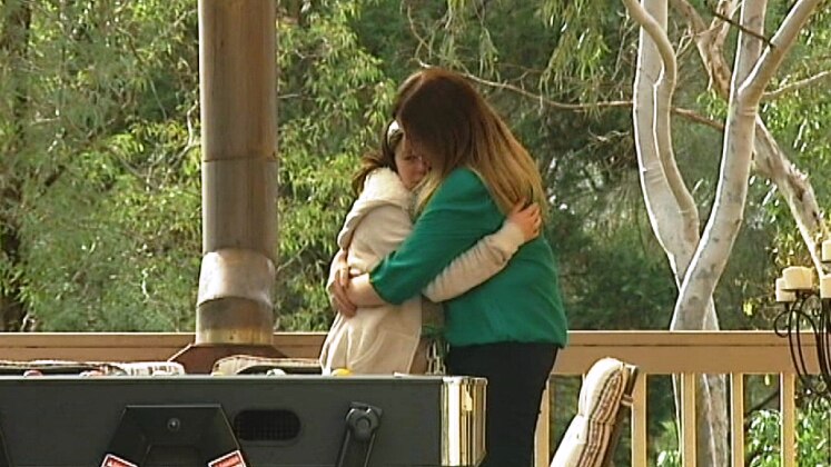 Louise Robbins hugs her daughter Eliza