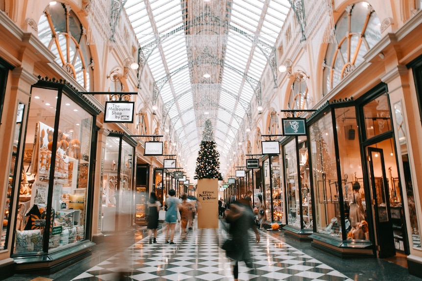 Inside of a shopping mall at Christmas time. Unsplash. 