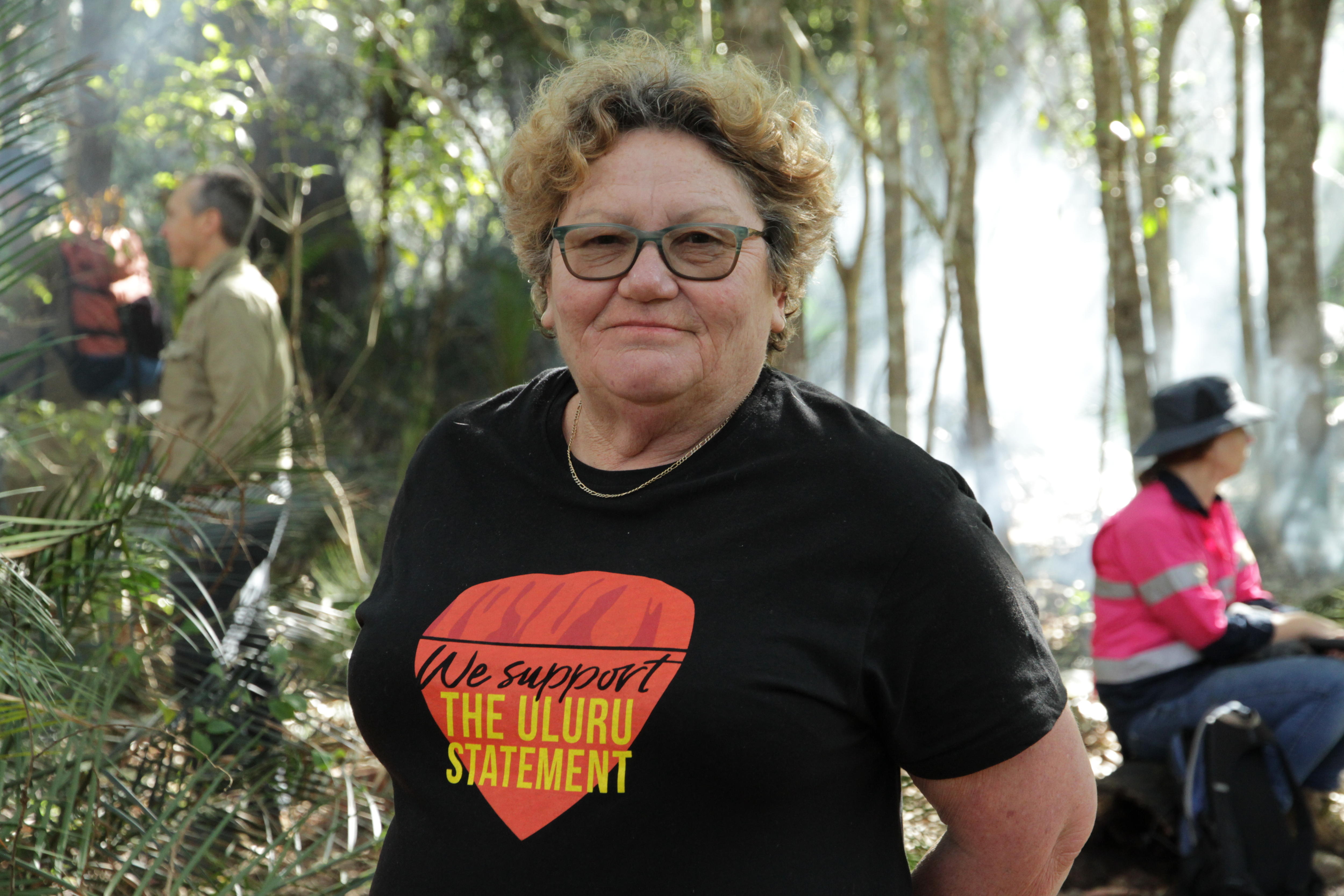 A woman smiles for the camera.