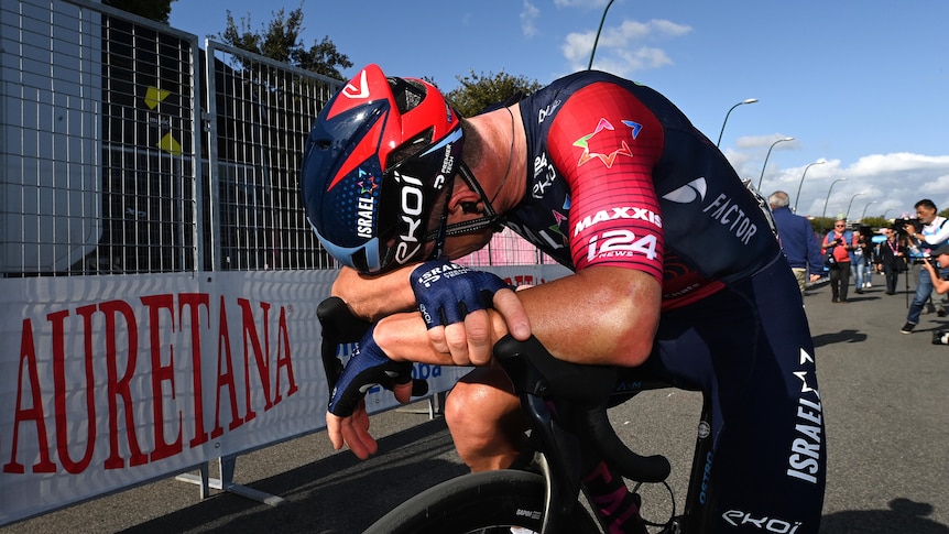 Simon Clarke slumps on his handlebars after Giro stage 6