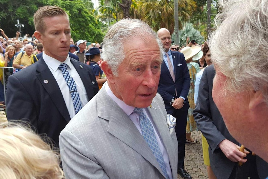 Prince Charles greets a member of the crowd in Brisbane City Botanic Gardens